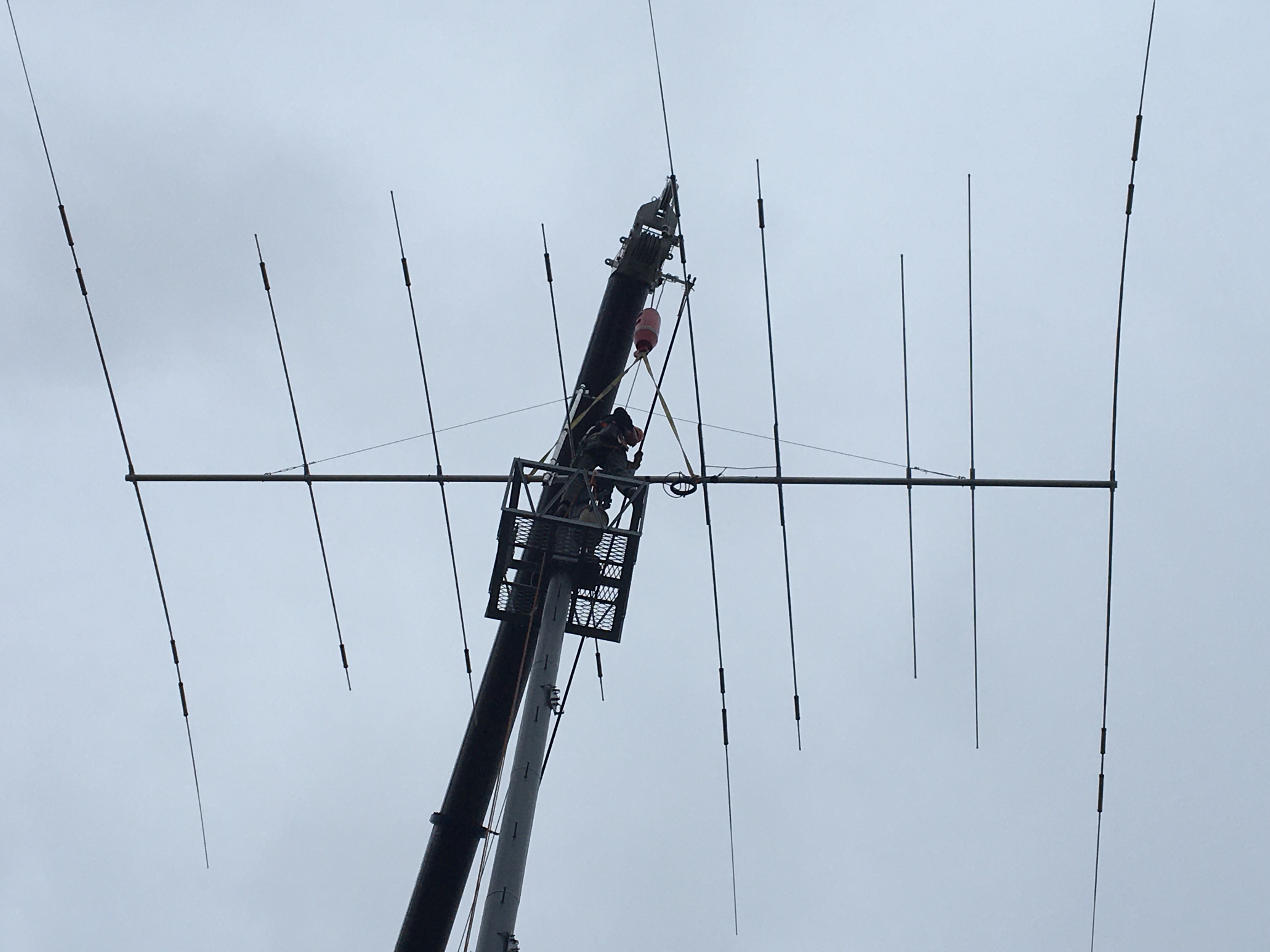 The new antenna is lowered onto the tower